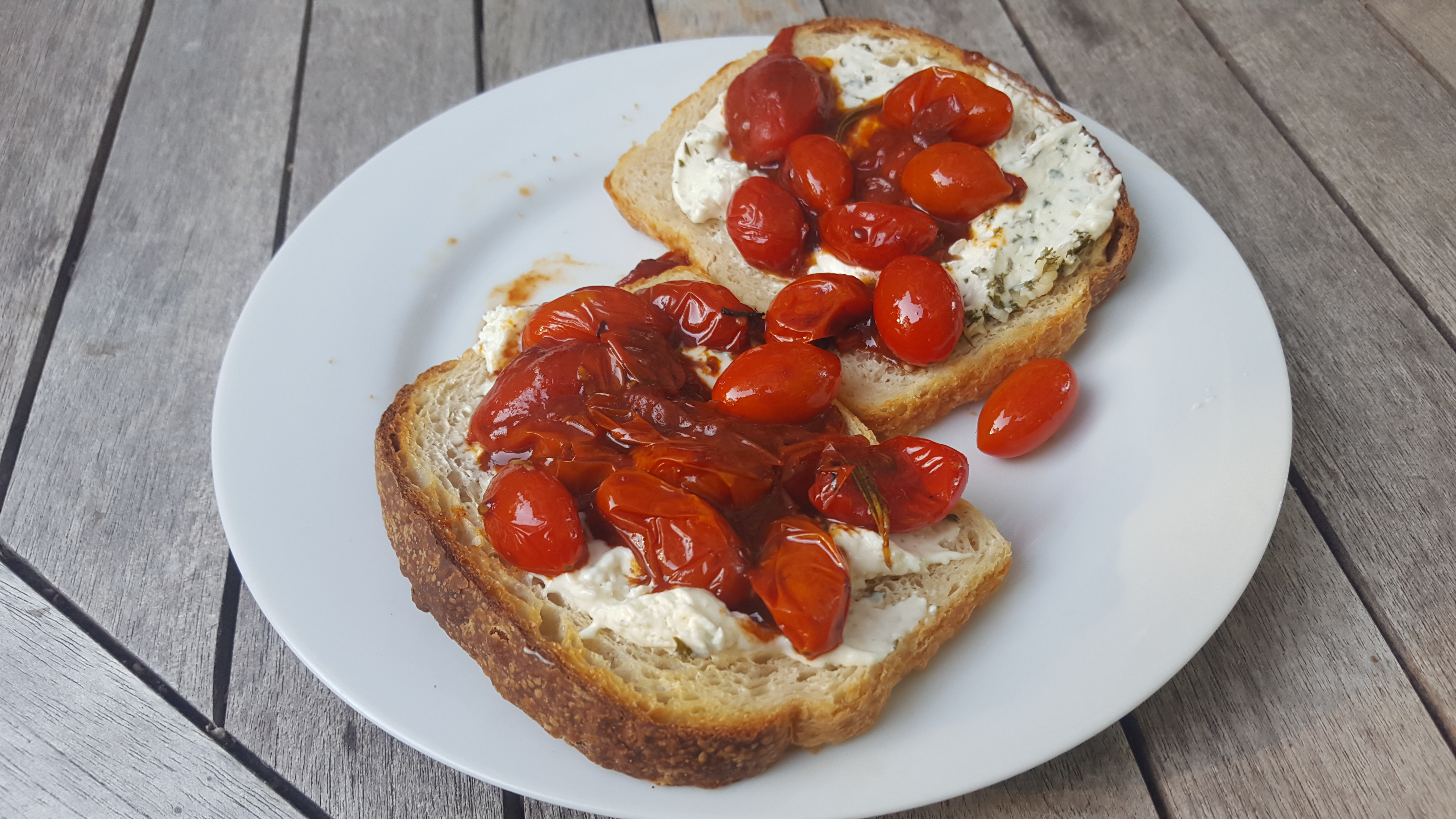 jammy tomatoes and herb cheese on toasted white bread